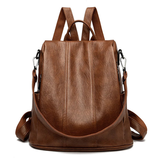Sac à Main et à Dos Femme Vintage Simili Marron, avec bretelles et bandoulière, sur un fond blanc.