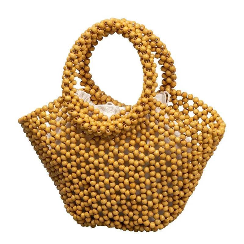 Sac à Main Panier Perle en Bois, de couleur beige et sur fond blanc.