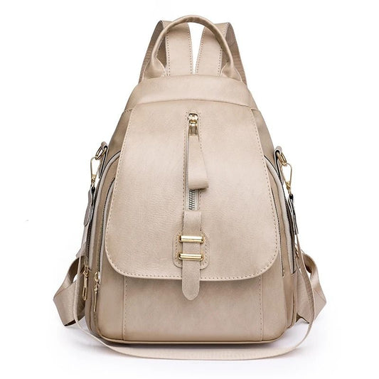 Sac à Main et à Dos Femme Sobre et Élégant, de couleur beige et sur fond blanc.